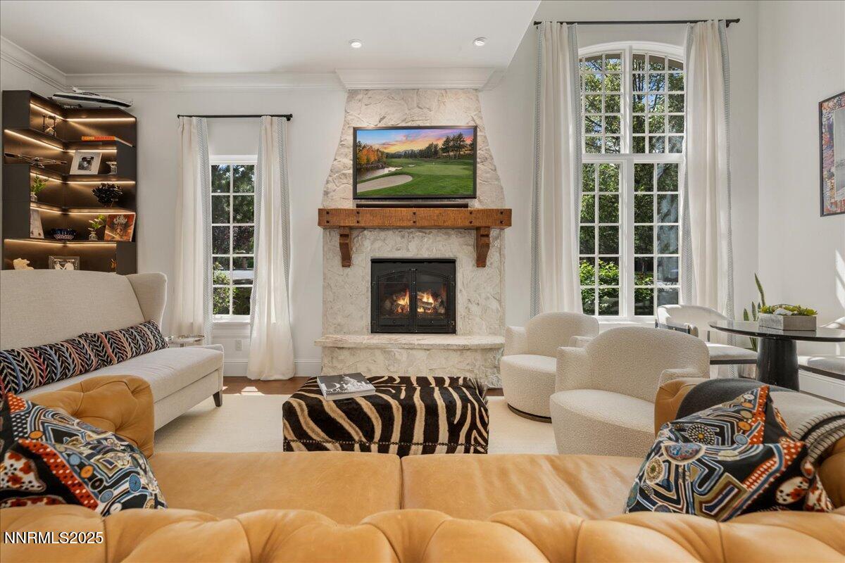 6360 Wetzel Court Reno, NV 89511 - Photo 8 of 43 a living room with furniture fireplace and a flat screen tv