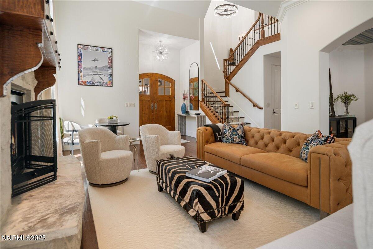 6360 Wetzel Court Reno, NV 89511 - Photo 9 of 43 a living room with furniture and a chandelier