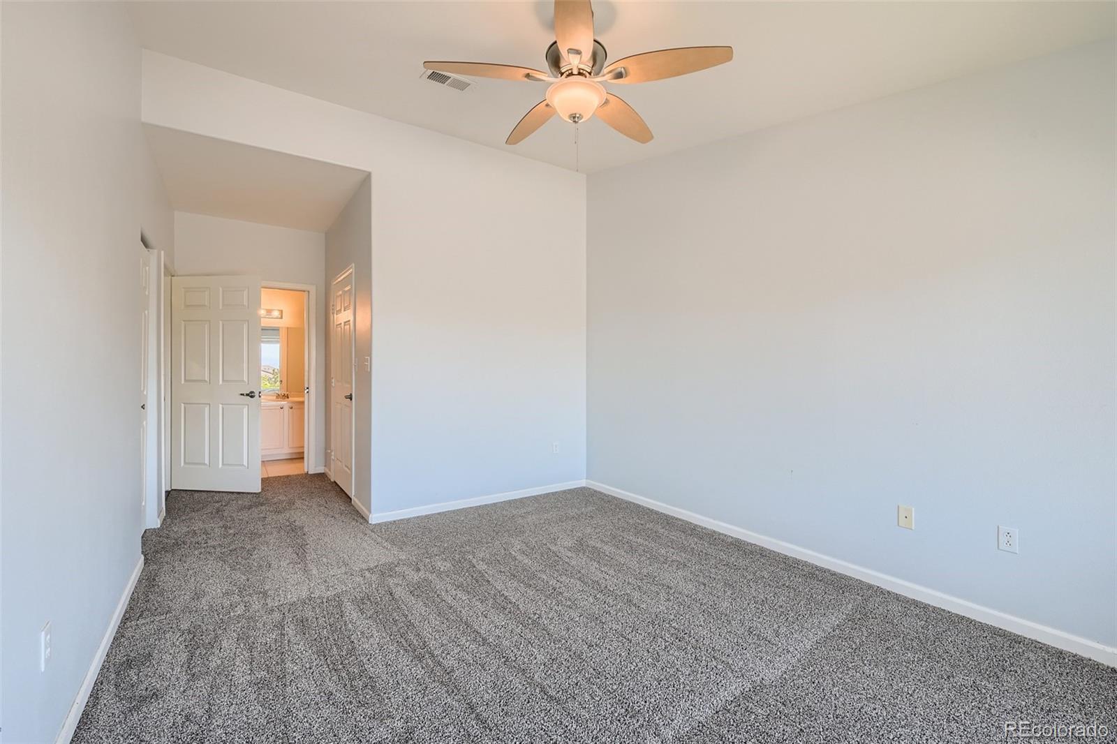 8468 South Thunder Ridge Way, Unit 204 Highlands Ranch, CO 80126 - Photo 14 of 33 wooden floor in an empty room