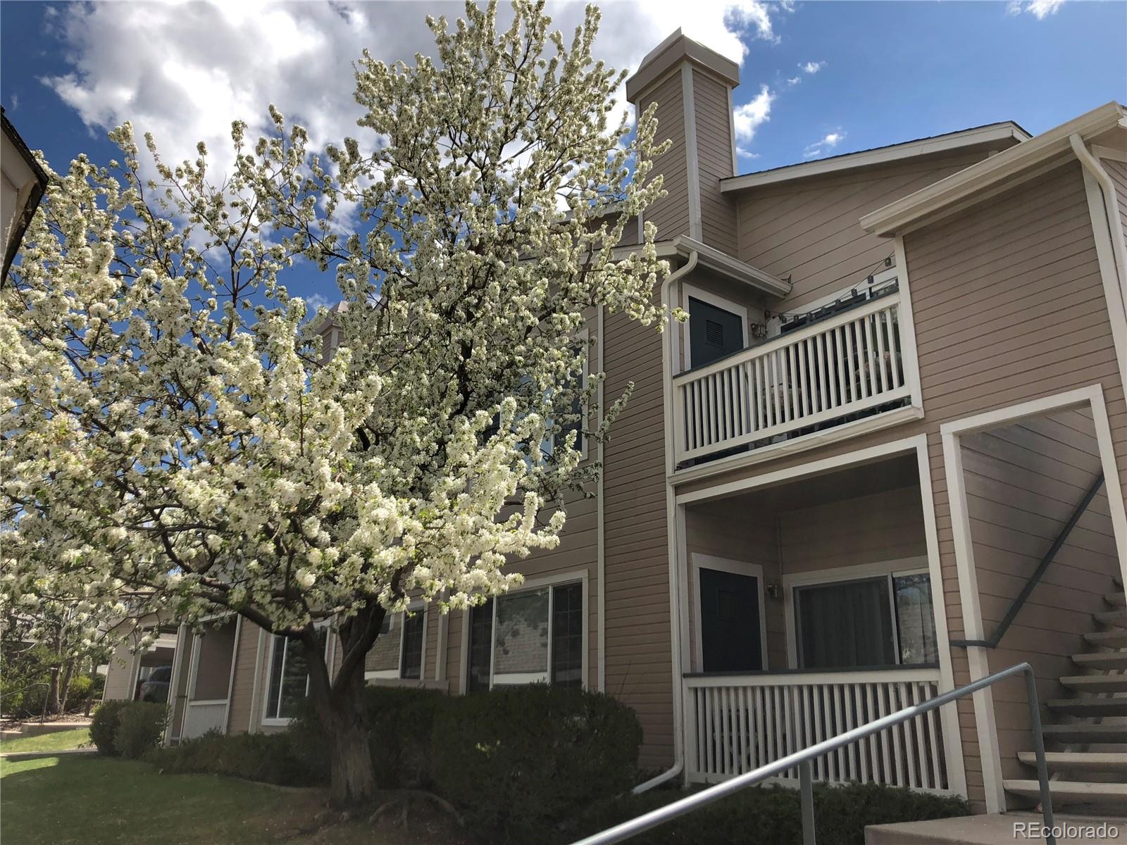 8468 South Thunder Ridge Way, Unit 204 Highlands Ranch, CO 80126 - Photo 28 of 33 a view of a house with a tree