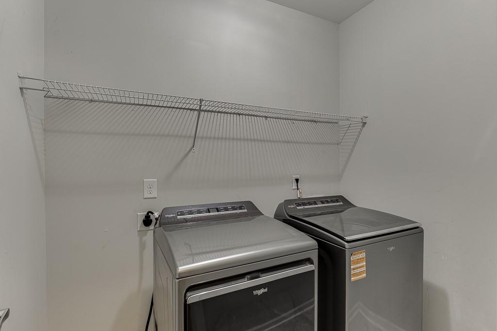 3265 Thimbleberry Trail Dacula, GA 30019 - Photo 25 of 61 a view of storage and utility room with washer and dryer