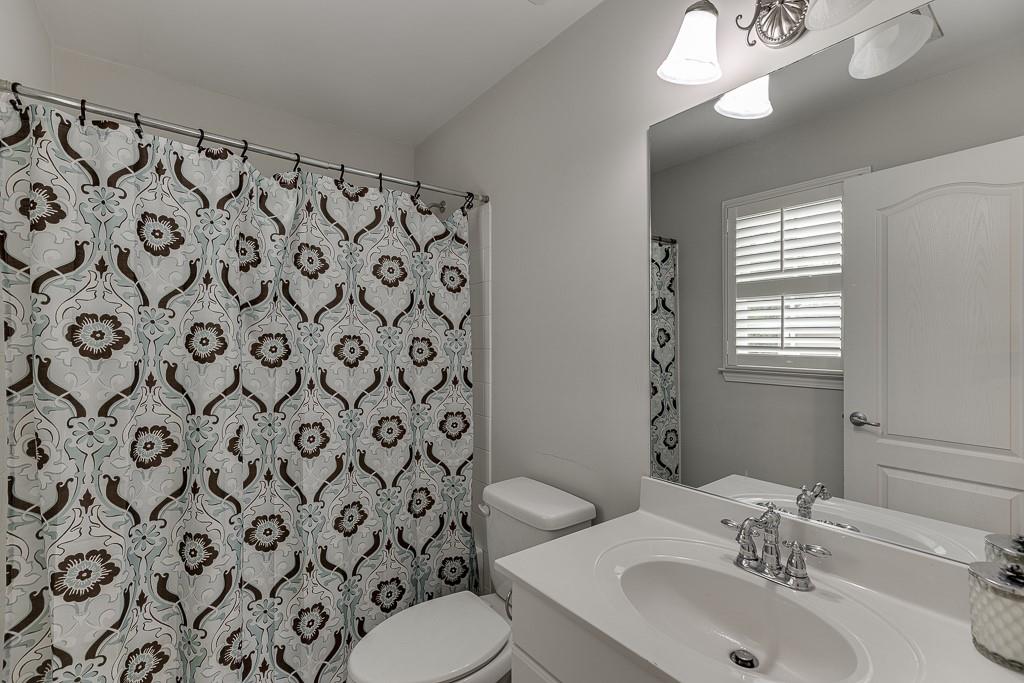 3265 Thimbleberry Trail Dacula, GA 30019 - Photo 34 of 61 a bathroom with a sink and a mirror