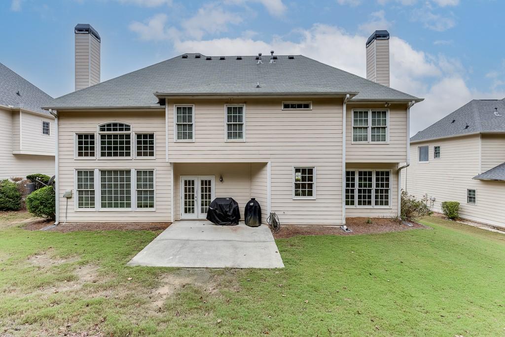 3265 Thimbleberry Trail Dacula, GA 30019 - Photo 40 of 61 a front view of a house with a yard and garage