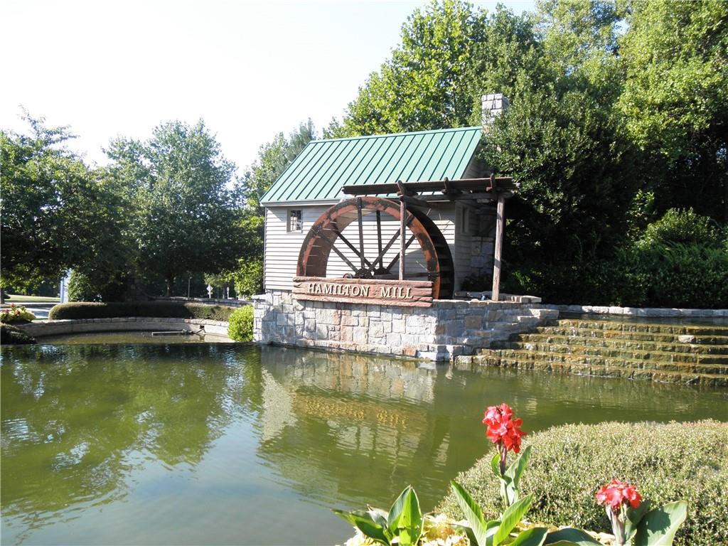 3265 Thimbleberry Trail Dacula, GA 30019 - Photo 48 of 61 a view of a lake with a house in the background