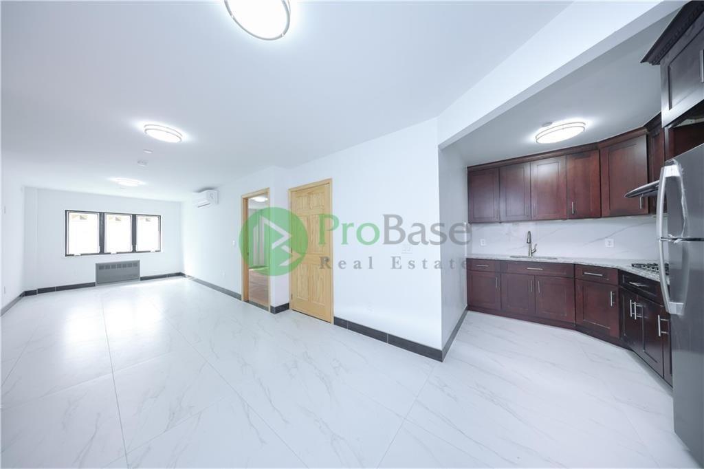 2837 West 19th Street, Unit 2B Brooklyn, NY 11224 - Photo 11 of 19 a view of a kitchen with a sink cabinets and entryway