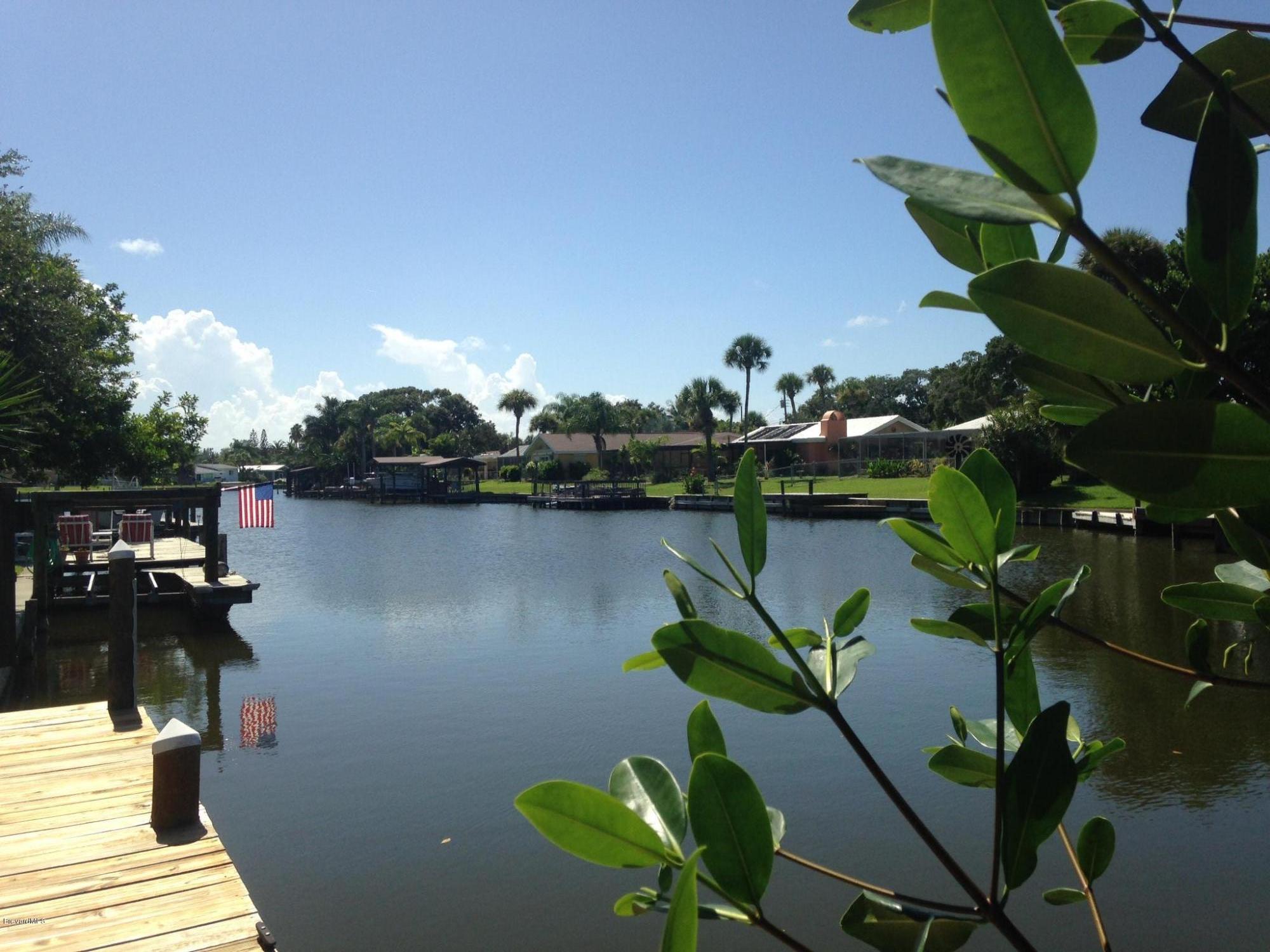 1025 Trinidad Road Cocoa Beach, FL 32931 - Photo 11 of 25 a view of a lake with a floor to ceiling