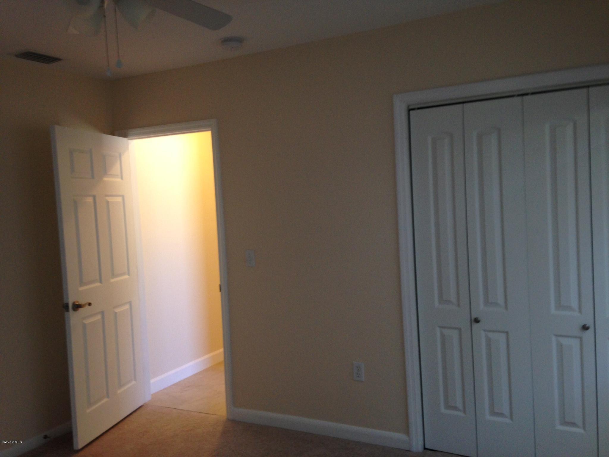 1025 Trinidad Road Cocoa Beach, FL 32931 - Photo 20 of 25 a view of a hallway with a window