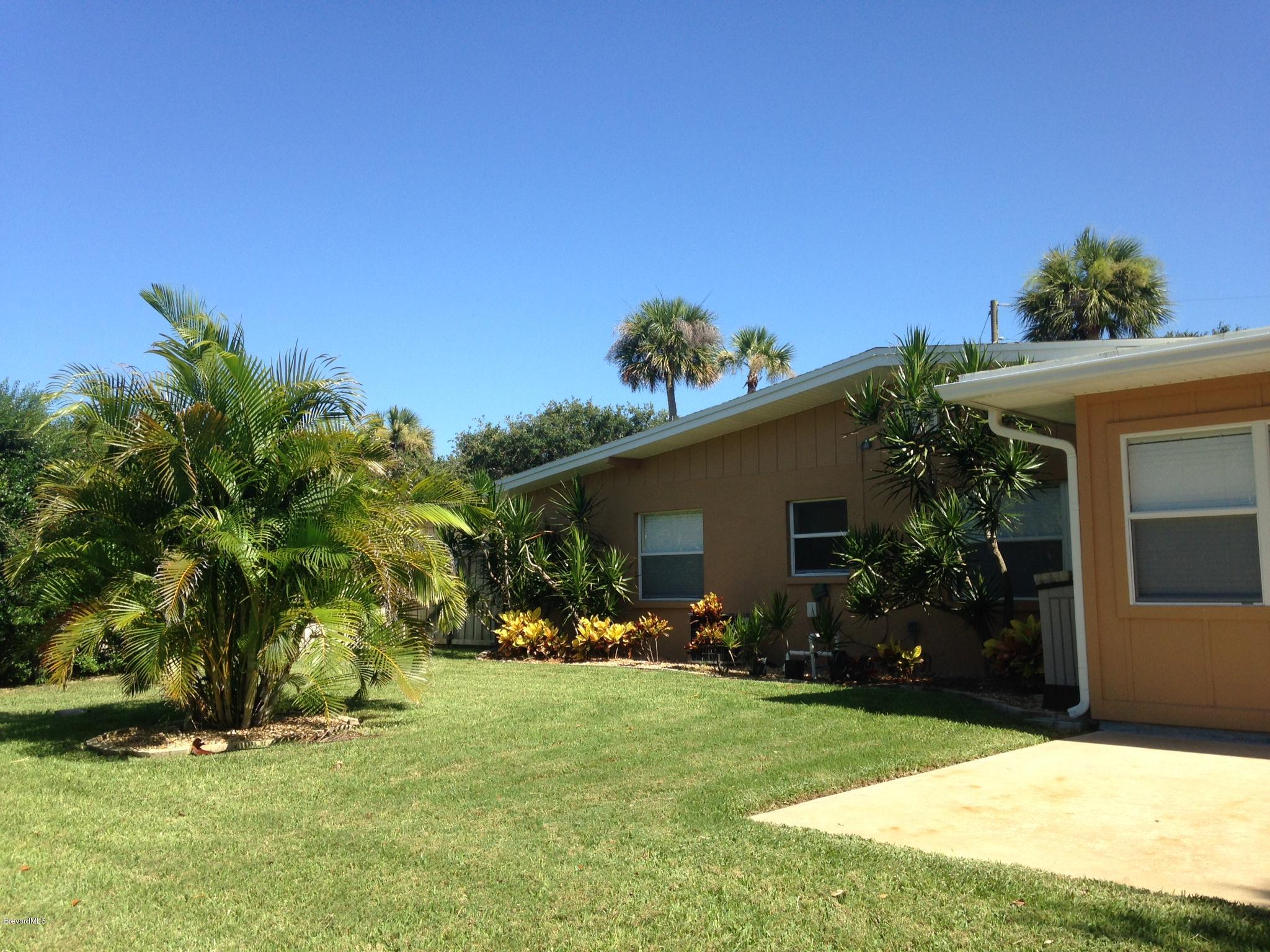 1025 Trinidad Road Cocoa Beach, FL 32931 - Photo 5 of 25 a front view of house with a garden