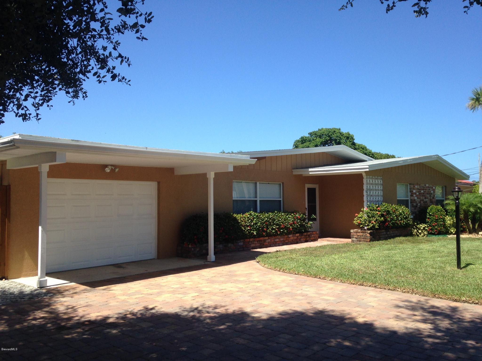 1025 Trinidad Road Cocoa Beach, FL 32931 - Photo 8 of 25 a view of a house with a yard