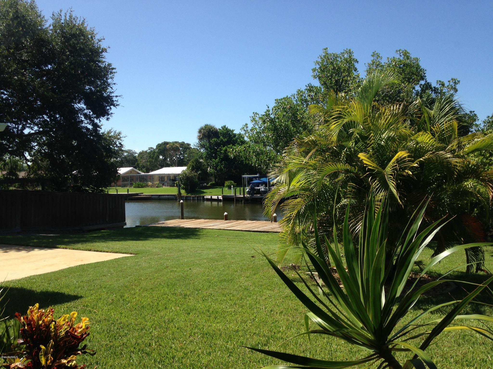 1025 Trinidad Road Cocoa Beach, FL 32931 - Photo 10 of 25 a view of a garden with a building in the background