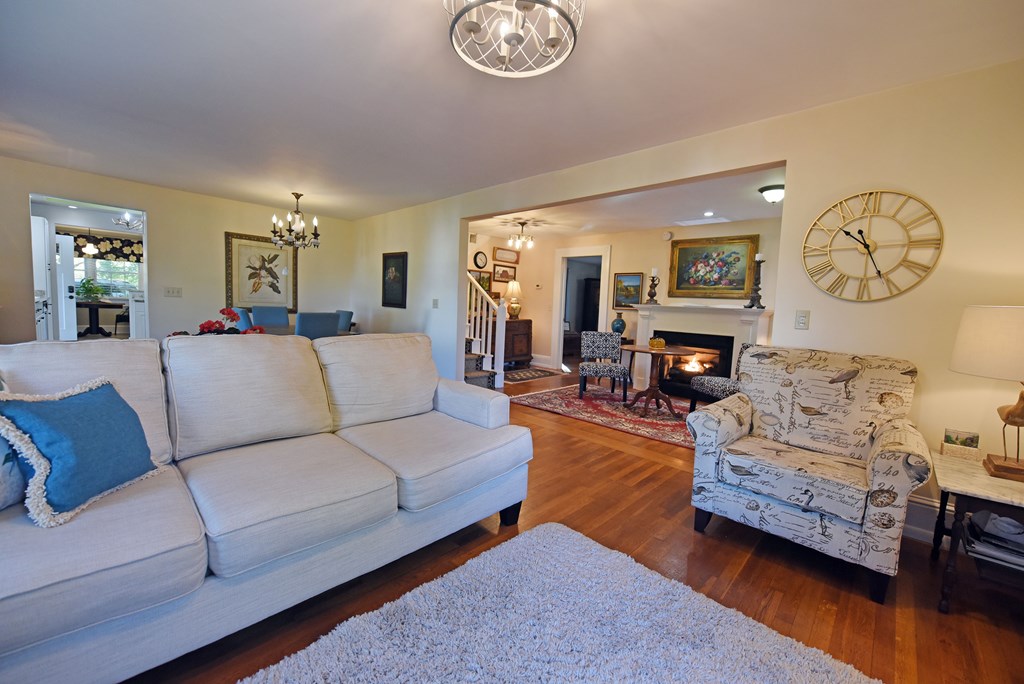 63 Loving Road Morganton, GA 30560 - Photo 20 of 58 a living room with furniture a fireplace and a large window