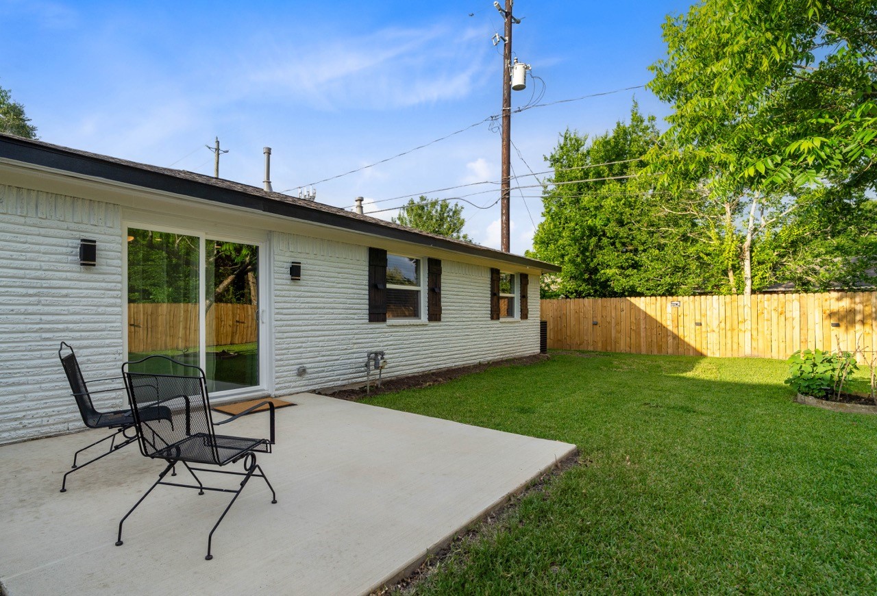 3138 Sunbeam Street Houston, TX 77051 - Photo 40 of 50 Enjoy peaceful outdoor living with a private patio, expansive yard, and mature pecan tree creating the perfect backyard retreat.