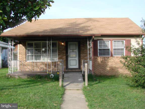 704 Middle River Road Baltimore, MD 21220 - Photo 1 of 28 a front view of a house with garden