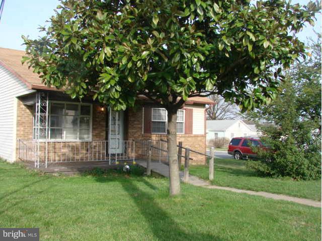 704 Middle River Road Baltimore, MD 21220 - Photo 2 of 28 a backyard of a house with table and chairs
