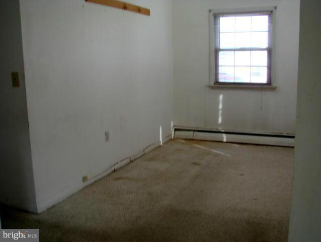 704 Middle River Road Baltimore, MD 21220 - Photo 12 of 28 an empty room with a window