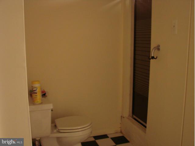 704 Middle River Road Baltimore, MD 21220 - Photo 18 of 28 a bathroom with a toilet and a shower
