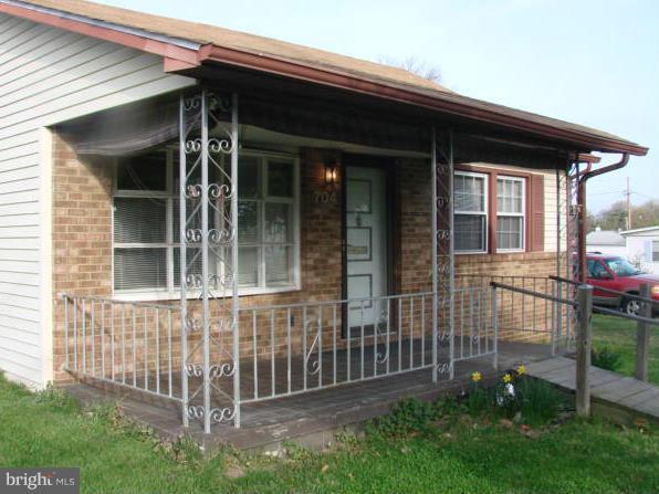 704 Middle River Road Baltimore, MD 21220 - Photo 3 of 28 front view of a house with a yard