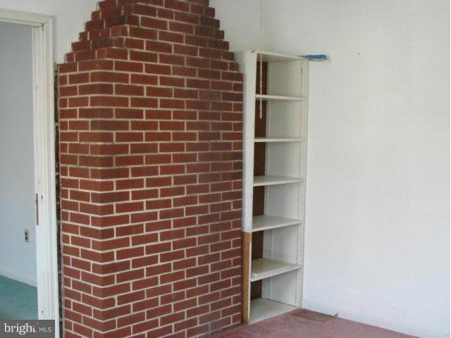 704 Middle River Road Baltimore, MD 21220 - Photo 23 of 28 a view of an empty room with empty racks