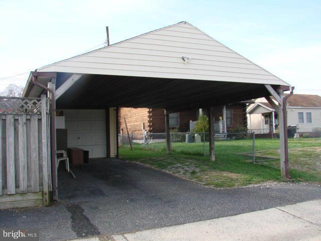 704 Middle River Road Baltimore, MD 21220 - Photo 25 of 28 a front view of a house with a yard