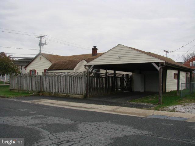 704 Middle River Road Baltimore, MD 21220 - Photo 28 of 28 a front view of a house with a garden
