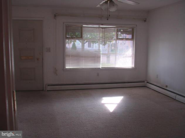 704 Middle River Road Baltimore, MD 21220 - Photo 5 of 28 an empty room with a window