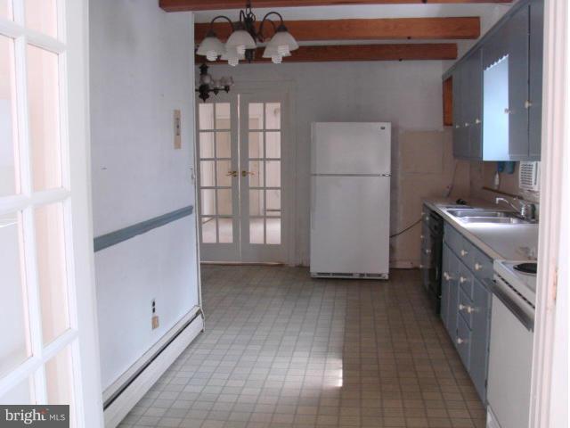 704 Middle River Road Baltimore, MD 21220 - Photo 8 of 28 a kitchen with stainless steel appliances a refrigerator and a sink