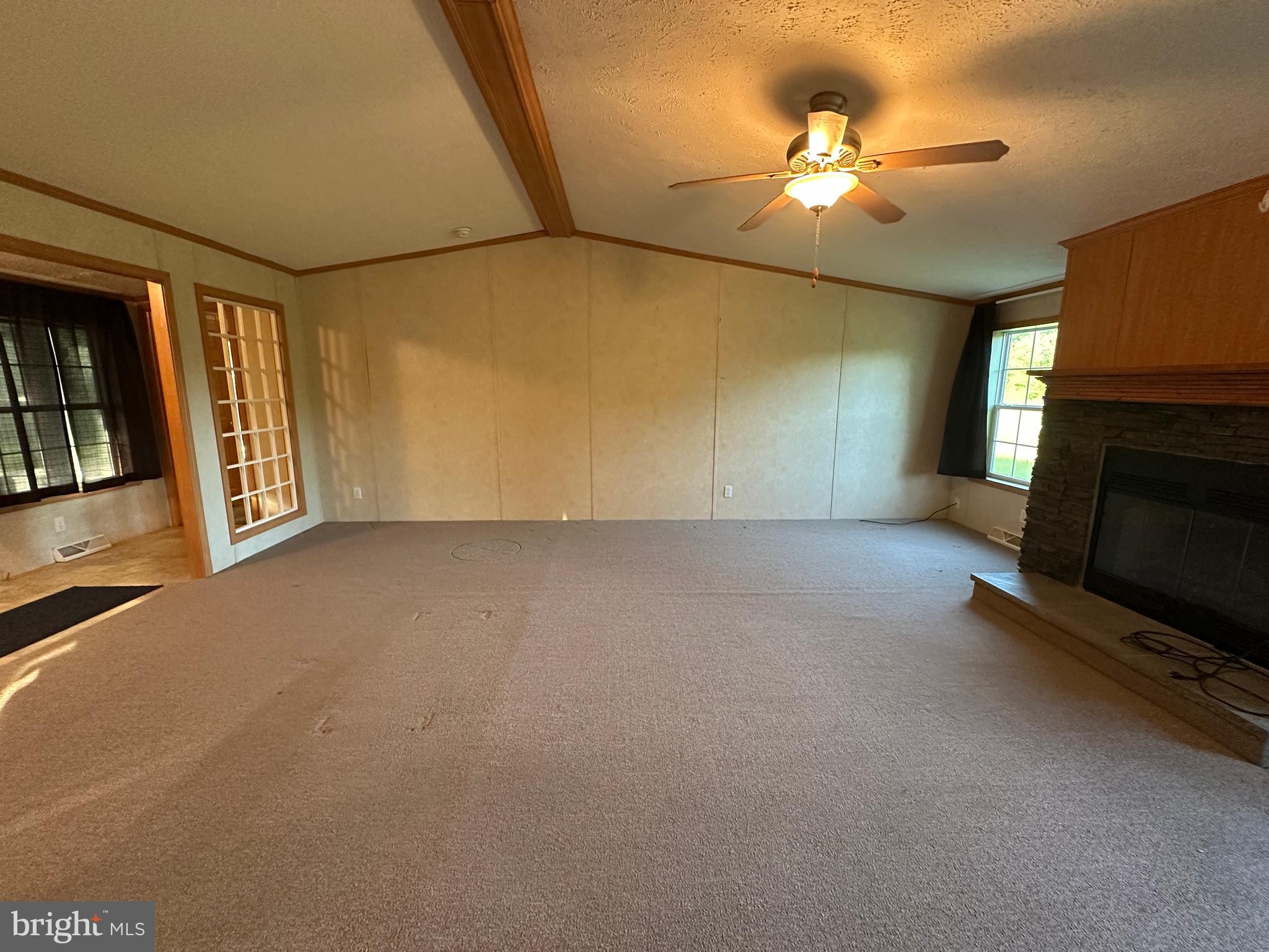 4391 Cito Road McConnellsburg, PA 17233 - Photo 32 of 67 a view of a livingroom with an empty space and a fireplace