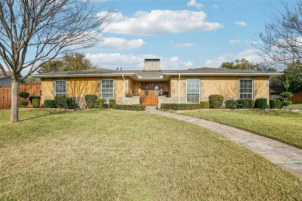 front view of a house with a yard
