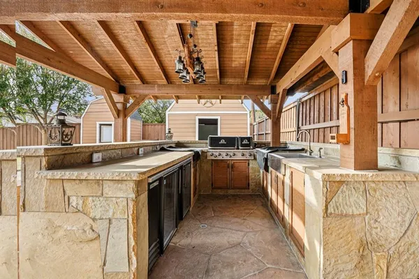 a kitchen with stainless steel appliances granite countertop a stove a sink and dishwasher