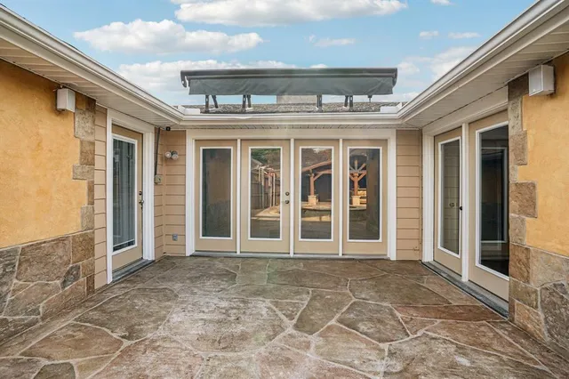 a view of a brick house with a large window
