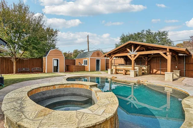 a front view of a house with swimming pool