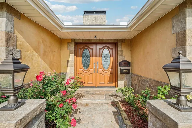 a front view of building with flowers