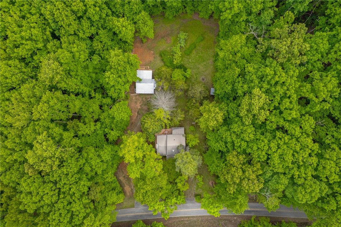 437 West Gate Road Pickens, SC 29671 - Photo 23 of 47 An aerial view showcases a verdant property nestled within a lush, treed landscape.
