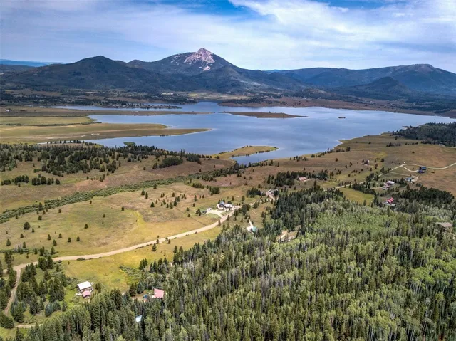 a view of swimming pool with outdoor seating and city view