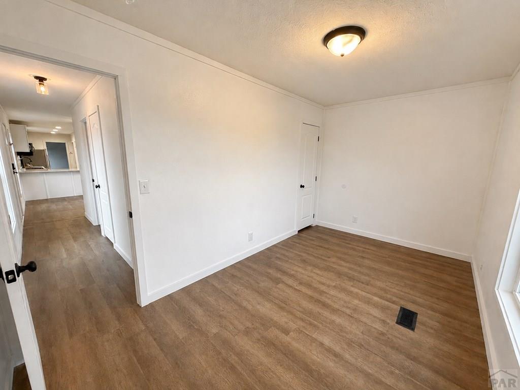 6652 County Rd HH.5 Lamar, CO 81052 - Photo 21 of 22 wooden floor in an empty room