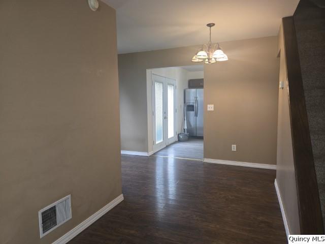 303 North Washington Street Carthage, IL 62321 - Photo 6 of 25 wooden floor in an empty room with a window