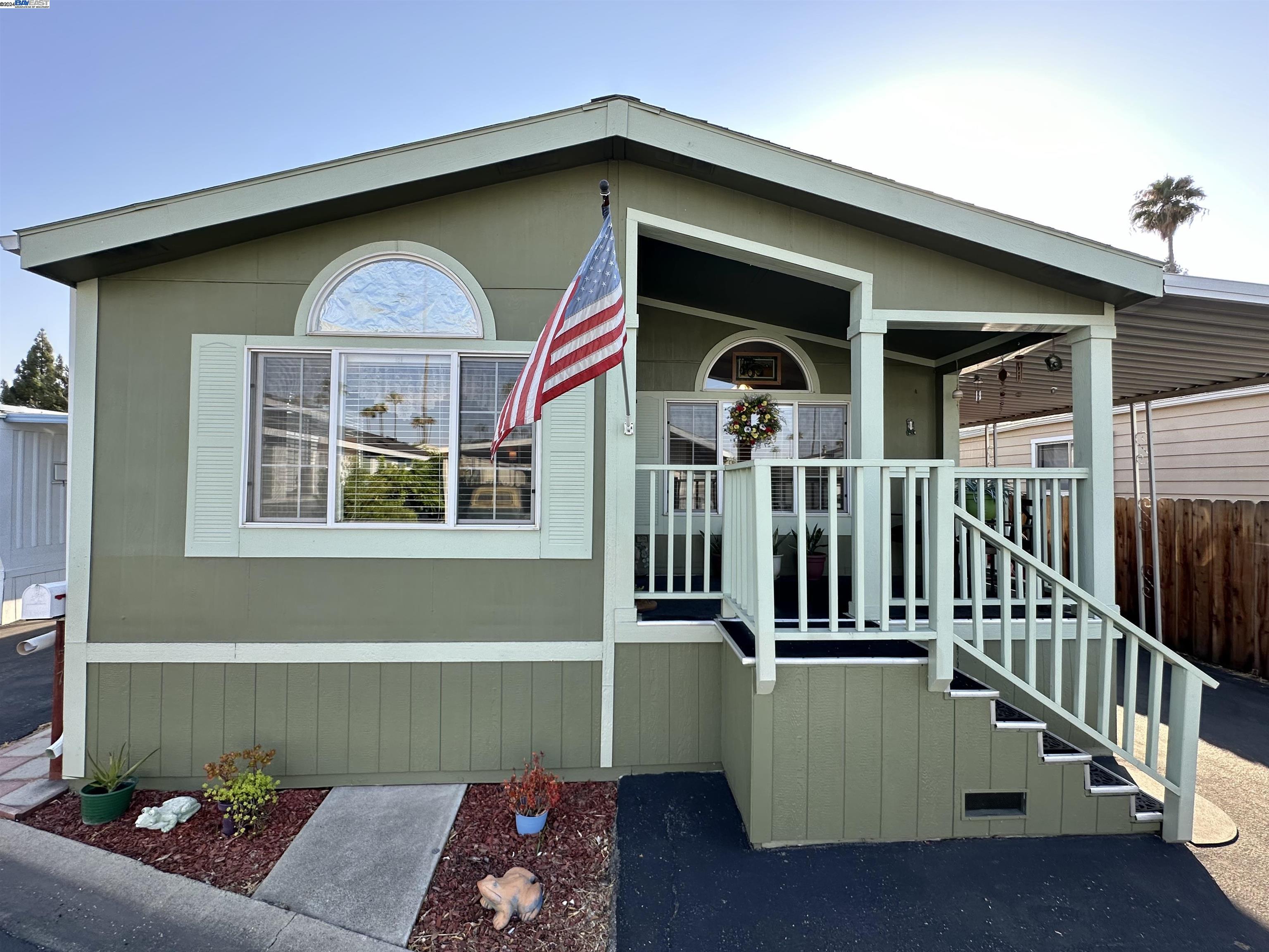 a front view of a house with deck