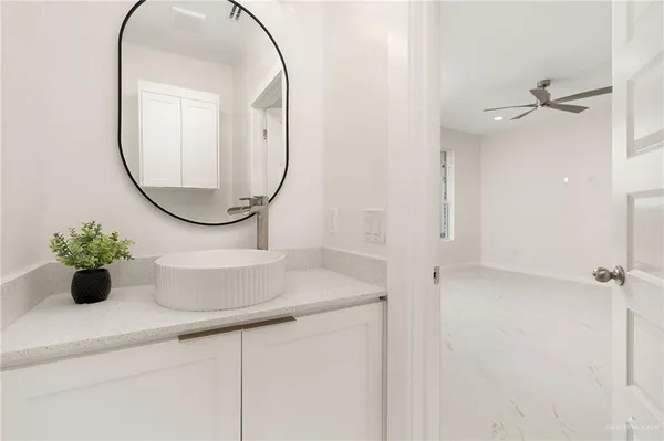 a bathroom with a sink and a mirror
