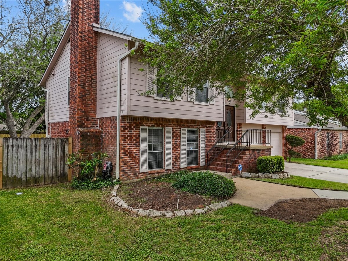 430 Redway Lane Houston, TX 77598 - Photo 2 of 43 a front view of a house with a yard and porch