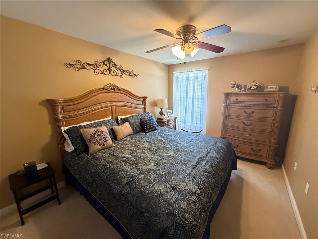 7264 Salerno Court Naples, FL 34114 - Photo 19 of 45 Bedroom featuring light carpet and ceiling fan
