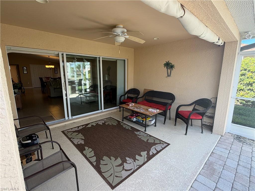 7264 Salerno Court Naples, FL 34114 - Photo 29 of 45 View of patio / terrace featuring a ceiling fan and an outdoor hangout area