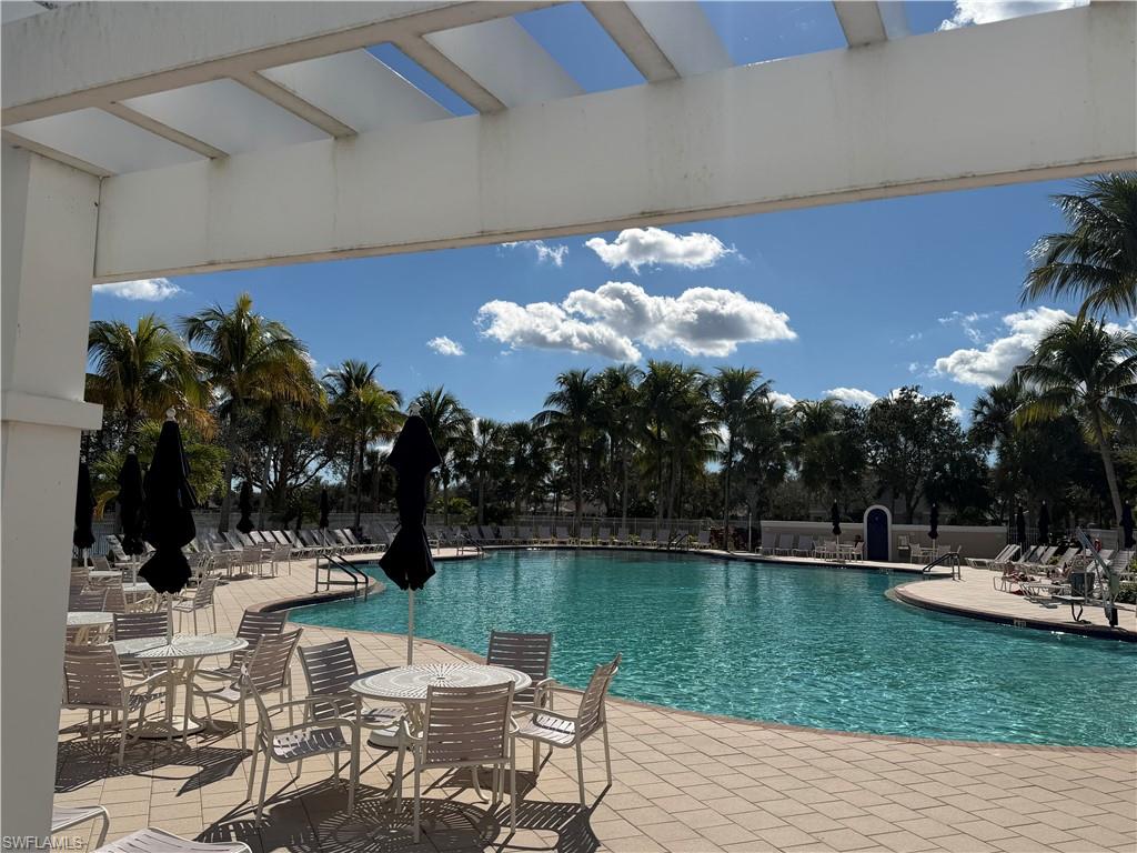 7264 Salerno Court Naples, FL 34114 - Photo 37 of 45 Community pool with a patio