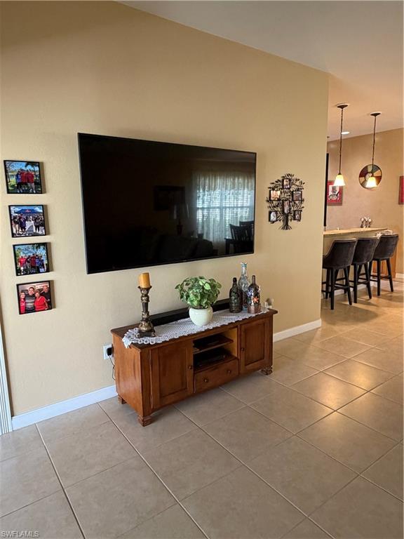 7264 Salerno Court Naples, FL 34114 - Photo 6 of 45 Corridor featuring light tile patterned floors