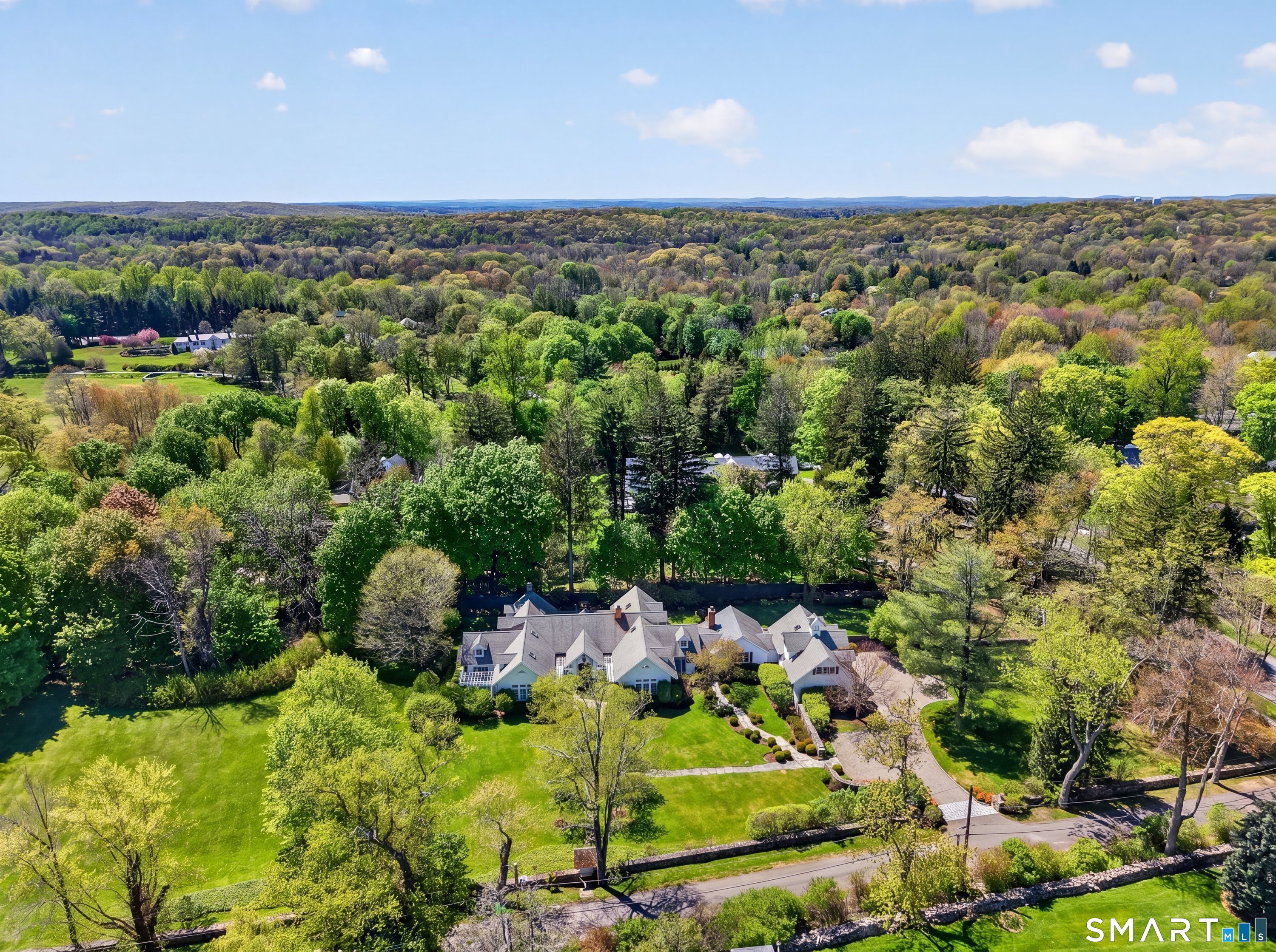 41 Peaceable Street Ridgefield, CT 06877 - Photo 40 of 40 an aerial view of a houses with a yard