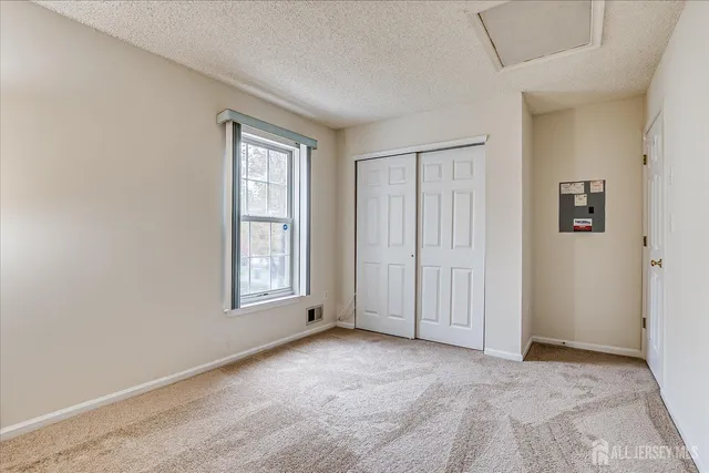 a room with a refrigerator and dryer