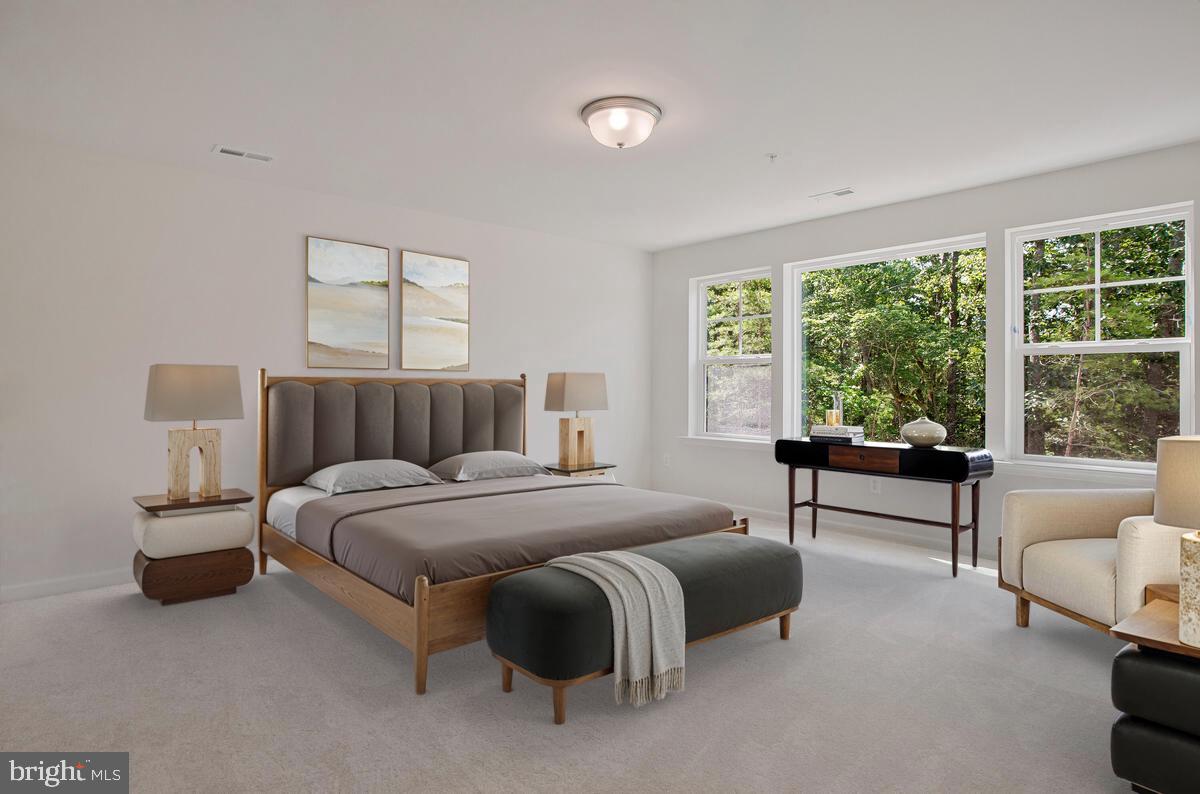 725 Nollmeyer Road Middle River, MD 21220 - Photo 17 of 28 a spacious bedroom with a bed and a couch next to a window