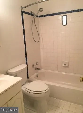 a bathroom with a toilet a sink and a shower