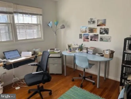 a view of a workspace with furniture and a workspace