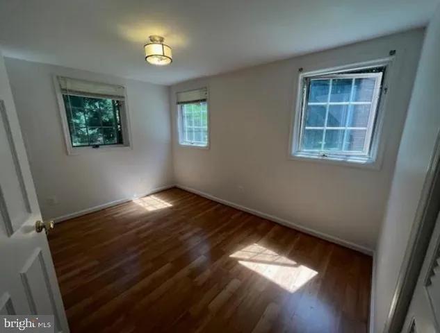 a kitchen with a refrigerator and a stove top oven