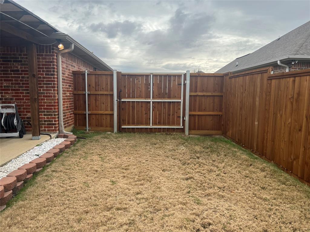 312 McAfee Street Mabank, TX 75147 - Photo 3 of 40 a view of a backyard